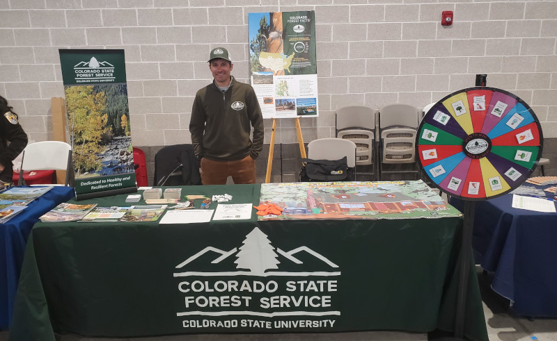 CSFS Alamosa Field Office staff maintaining an education booth at a community event. 